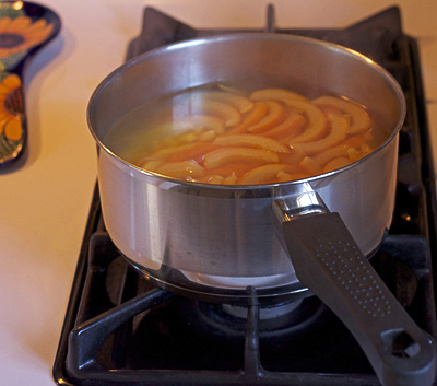 orange rinds in saucepan